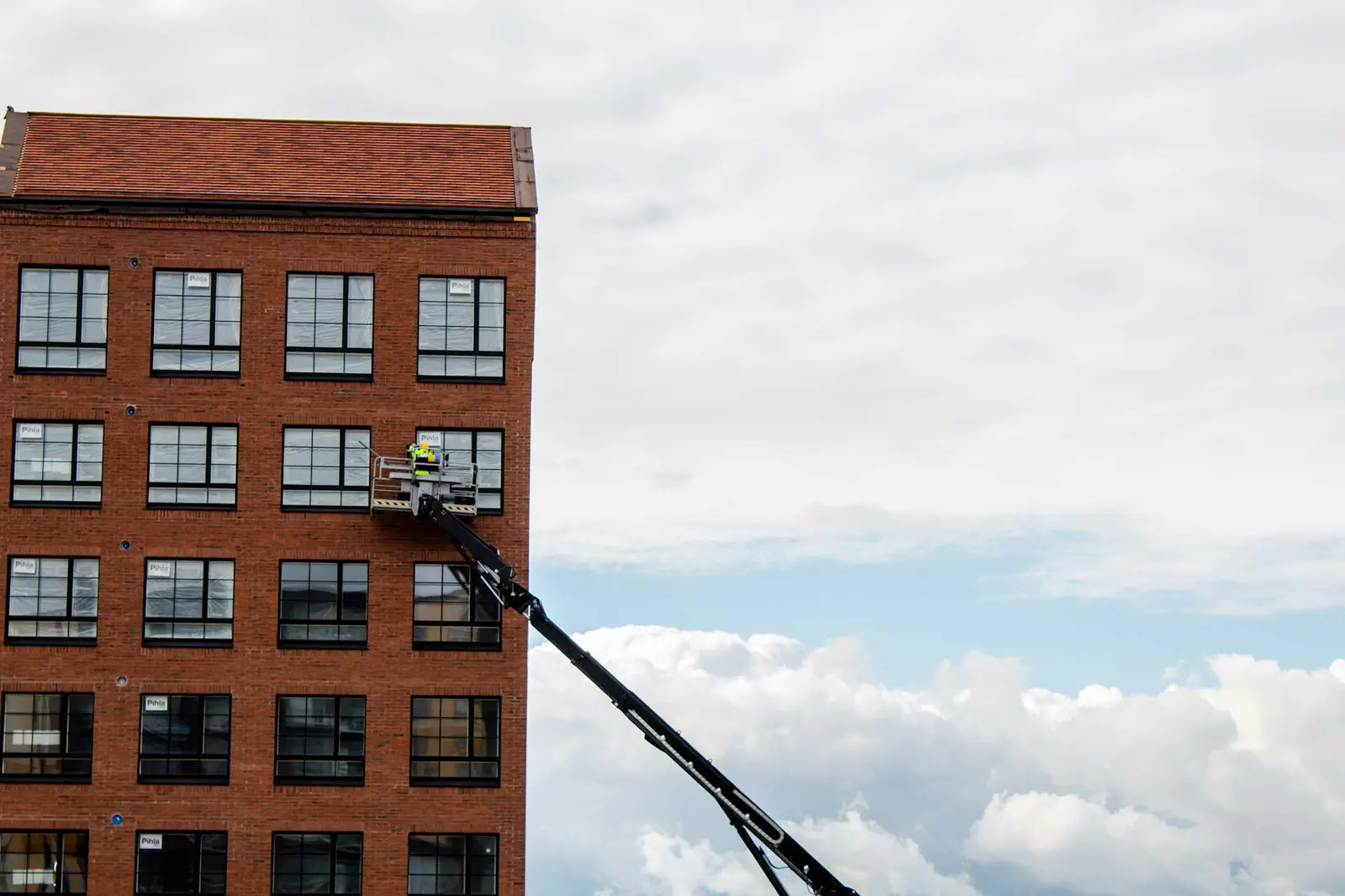 Specialist inspecting a building facade